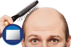 colorado a balding man brushing his hair