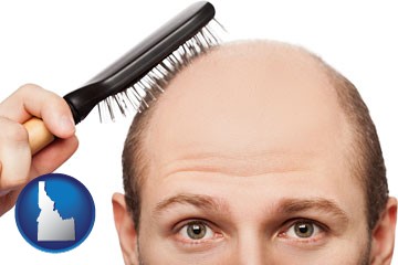 a balding man brushing his hair - with Idaho icon